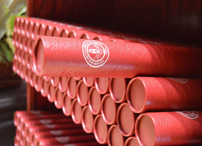 Rows of NECO diplomas in red tubes