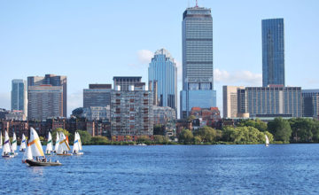Sailboats on Charles river in front of Prudential Center in Boston
