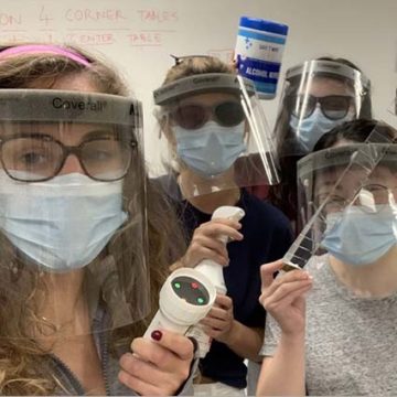 4 female students wearing glasses, surgical masks, and face shields