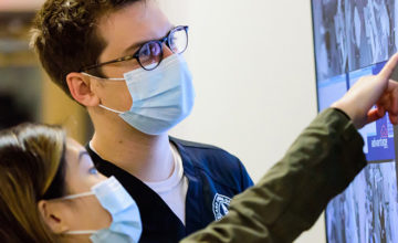 Ben Young and another faculty overseeing a lab course.