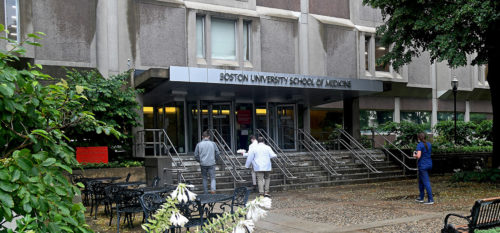 Students entering the front door of Boston University School of Medicine.