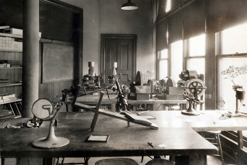 old sepia photograph of historical optical lab