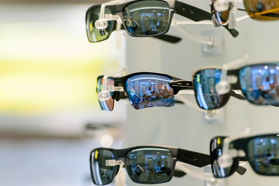 wall of sunglasses on display in the eye clinic