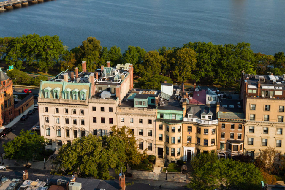 Aerial view of Beacon St campus with Charles River in background.